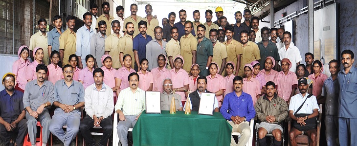 Mr.Jacob Mathew, DGM - Nilgiri Wynad Group and Mr.V.M.Madhavan, Sussex Tea Factory-Manager with the 'Golden Leaf India Awards' awarded to Sussex for best CTC Fannings and CTC Dust with the Executives, Staffs and Workers of Sussex Estate & Factory 
